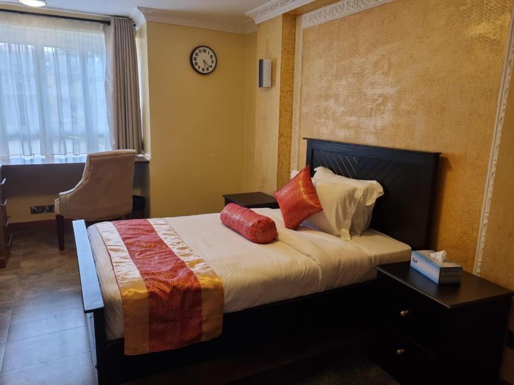 Postel nebo postele na pokoji v ubytování Asyana Gardens