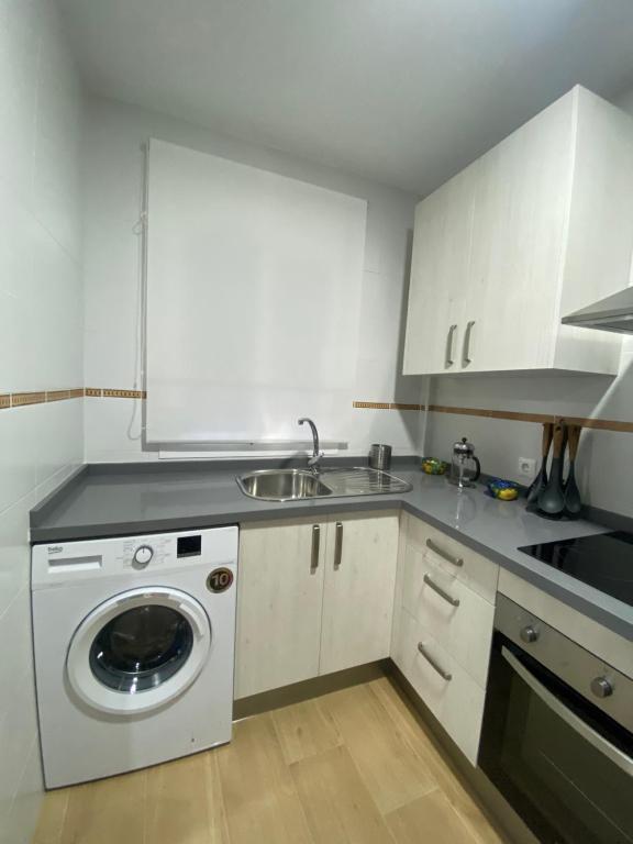 Kuchyň nebo kuchyňský kout v ubytování Apartamento ANY