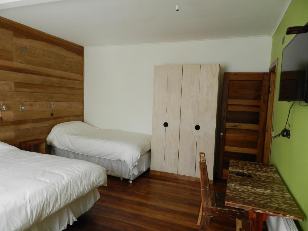 A bed or beds in a room at Aroma Verde Hotel