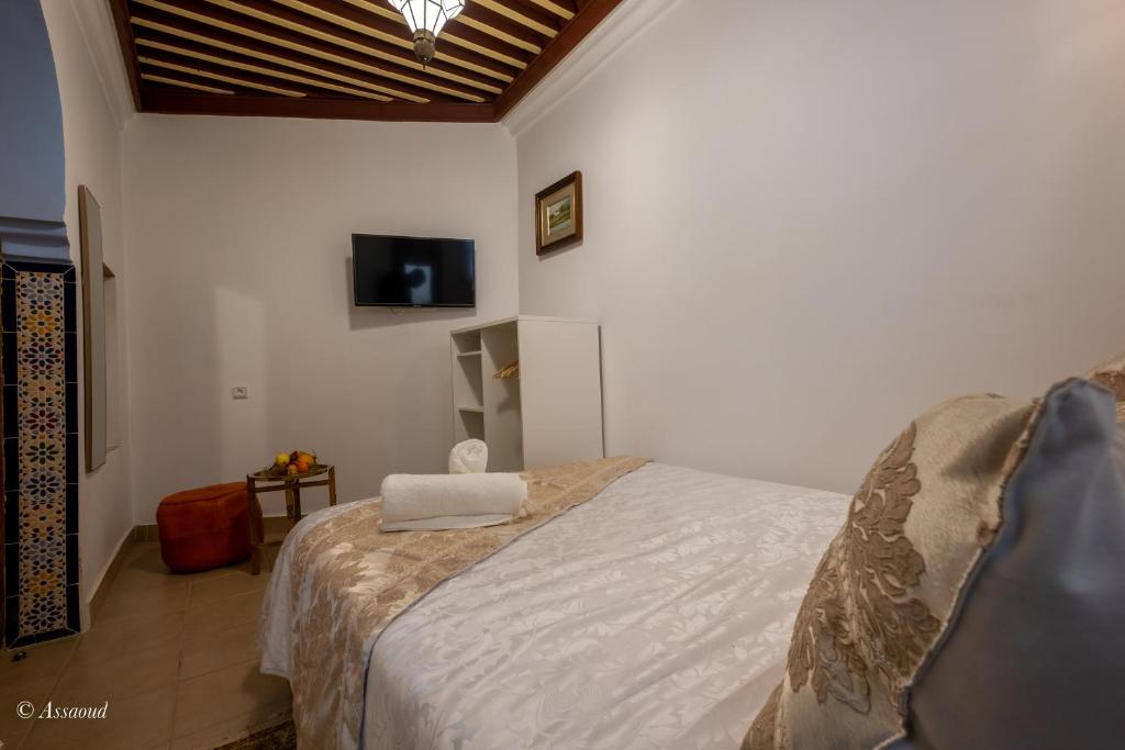 Postel nebo postele na pokoji v ubytování Riad Bin Souaki