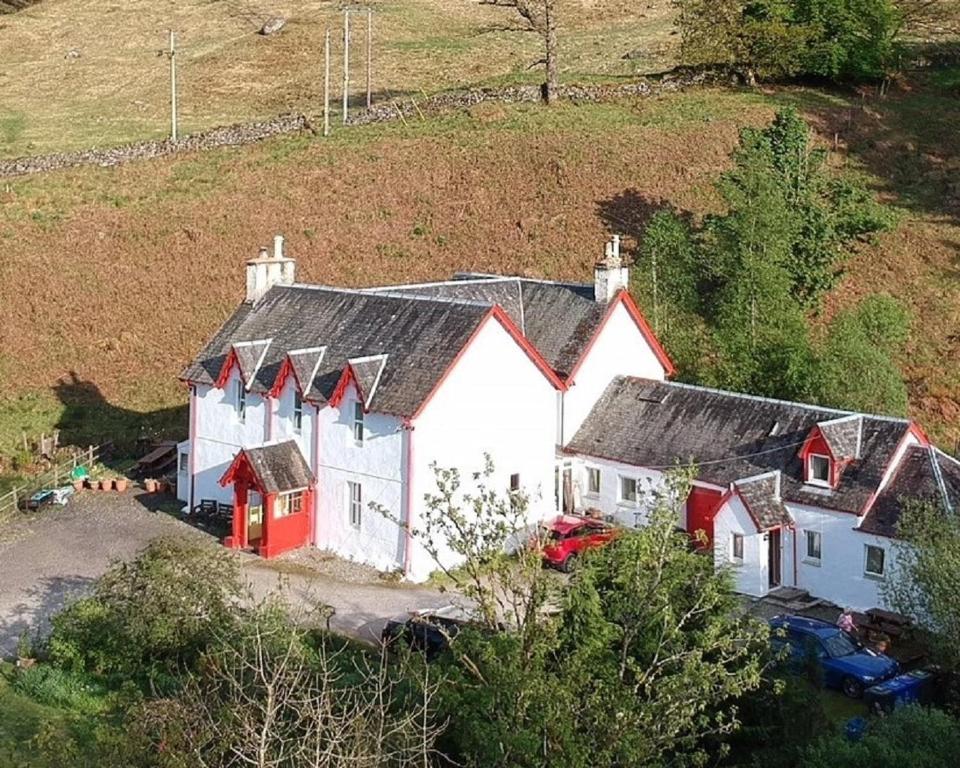 an aerial view of a white and red house at Inverardran House Bed and Breakfast in Crianlarich