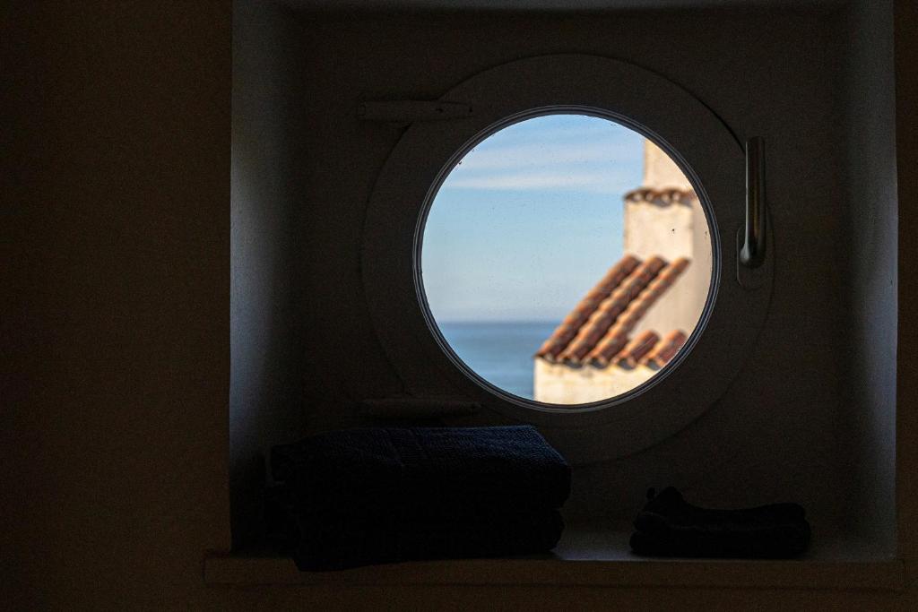 a window in an airplane looking out at the ocean at Villa Anvers Guethary in Bidart