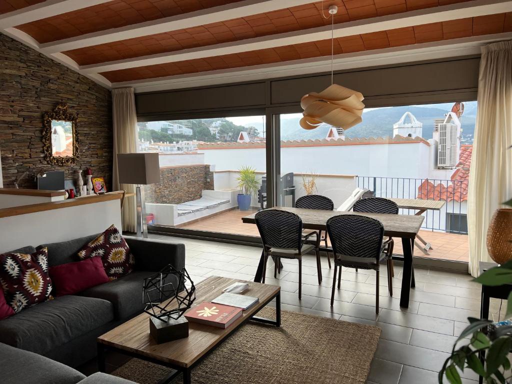 a living room with a couch and a table at Big family house in the Center of el port de la selva in Port de la Selva