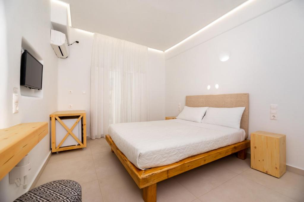 Voodi või voodid majutusasutuse Hotel Thira toas