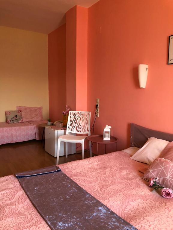 Postel nebo postele na pokoji v ubytování Hotel Rodini