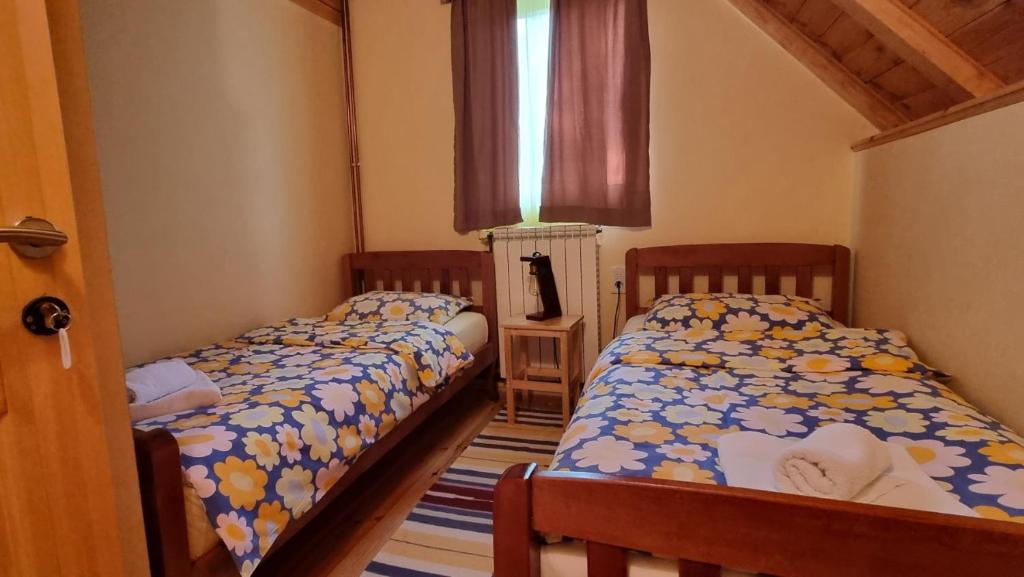 Postel nebo postele na pokoji v ubytování Jankovic Chalet