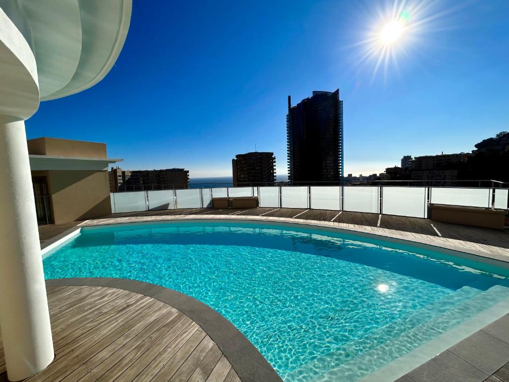 Bazén v ubytování Luxueux Studio Neuf - Frontière Monaco - Piscine - Parking privé nebo v jeho okolí