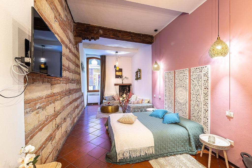 Posteľ alebo postele v izbe v ubytovaní White & Gold Suite Verona