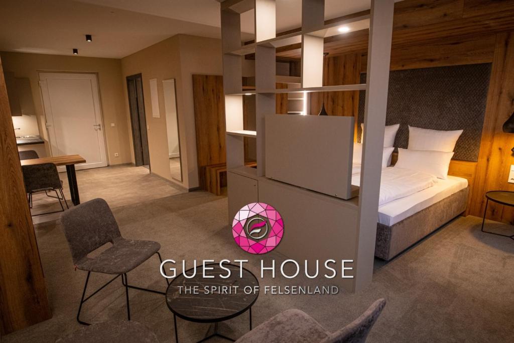 Postel nebo postele na pokoji v ubytování GUESTHOUSE FELSENLAND