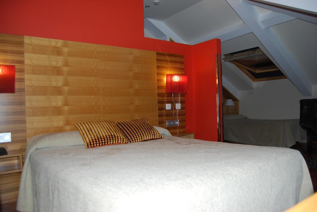 Postel nebo postele na pokoji v ubytování Hotel Spa QH Centro León