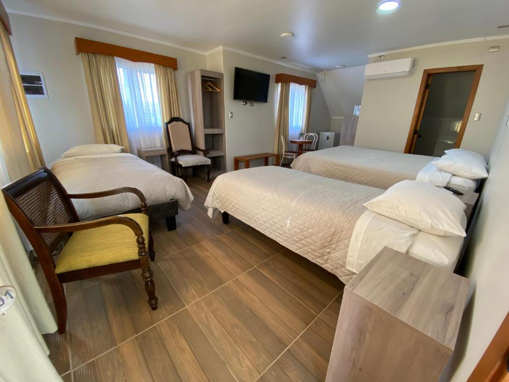 Postel nebo postele na pokoji v ubytování Hotel Casona Los Colonos