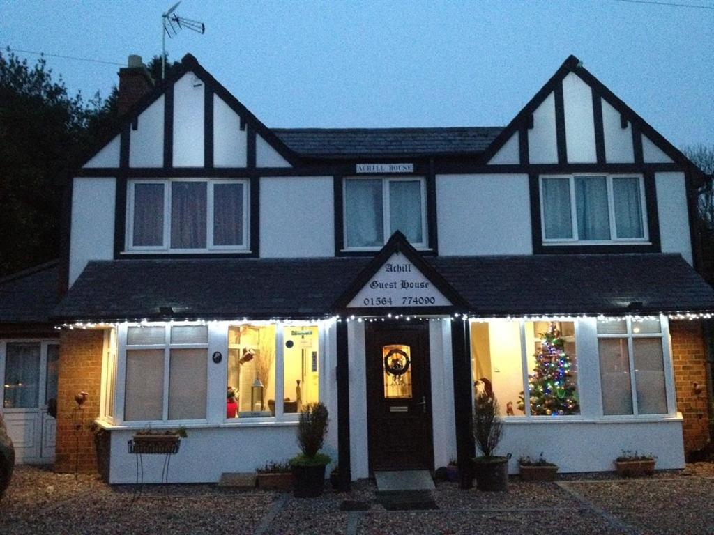 a house with a christmas tree in front of it at Achill Guest House in Solihull