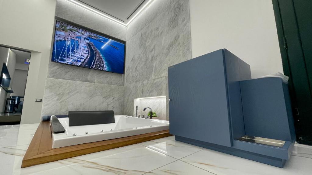 TV a/nebo společenská místnost v ubytování I Cappuccini Suite