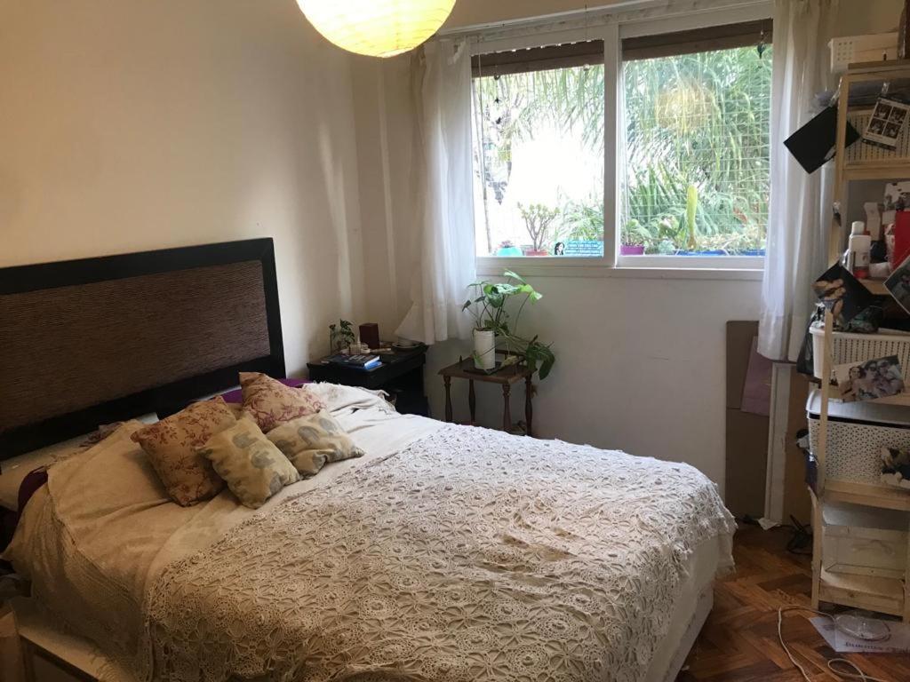 a bedroom with a bed with two pillows on it at Departamento en Palermo in Buenos Aires