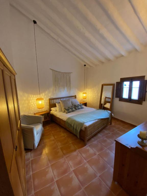 Postel nebo postele na pokoji v ubytování Acogedora Casa Rural en Olvera La Morada