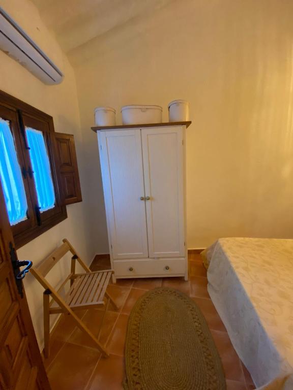 Postel nebo postele na pokoji v ubytování Acogedora Casa Rural en Olvera La Morada