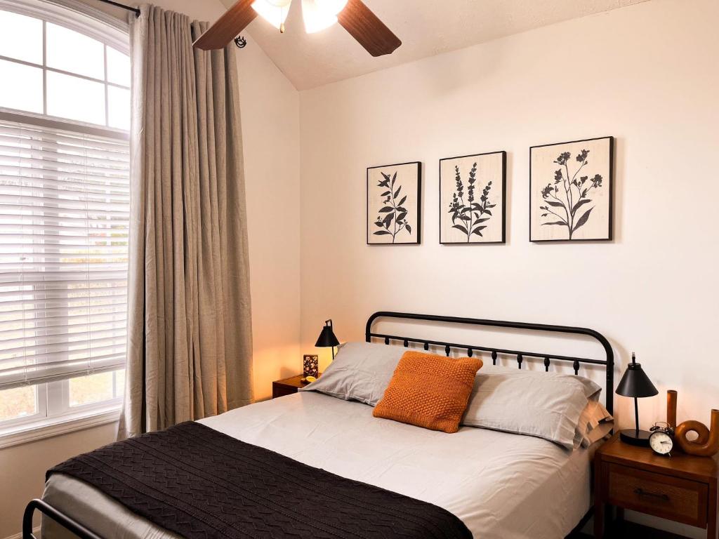 a bedroom with a bed and a window at Lovely House II in Auburn