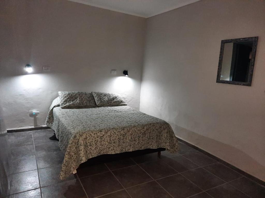 A bed or beds in a room at Departamento Los Nonos
