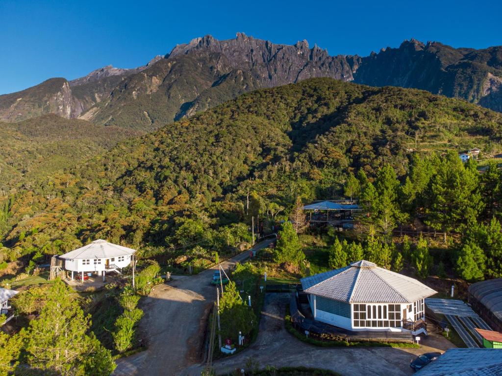 an aerial view of a house and a mountain at La Cantane Villa in Kundasang