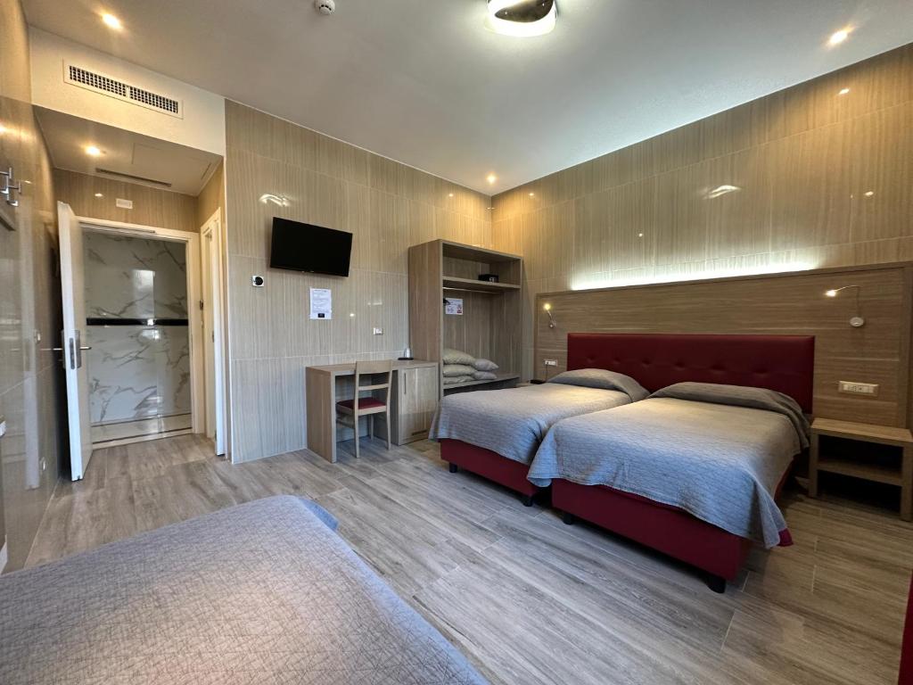 Postel nebo postele na pokoji v ubytování Hotel Midway