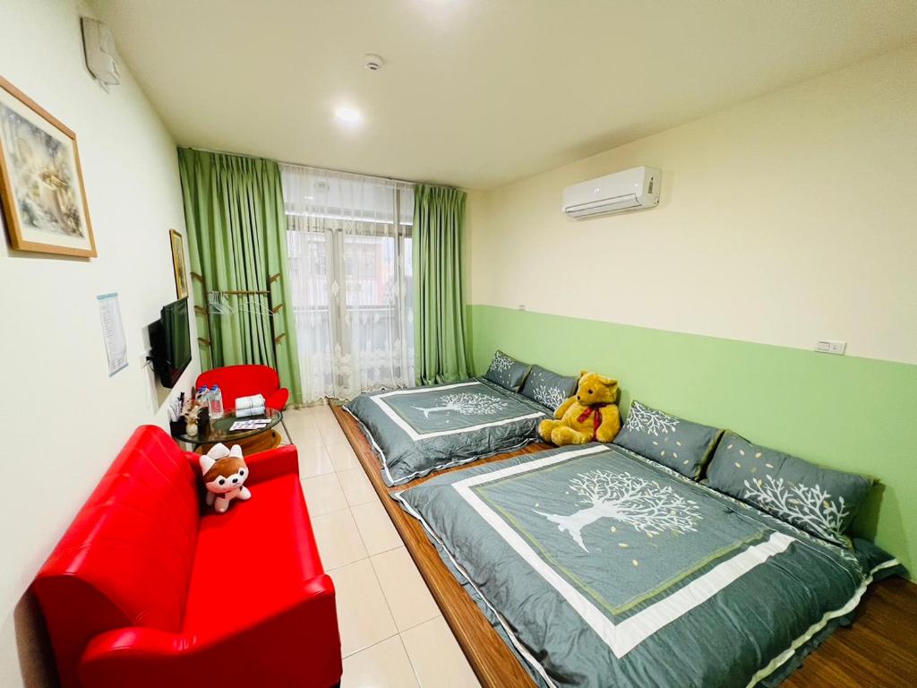Postel nebo postele na pokoji v ubytování Qianshun Homestay