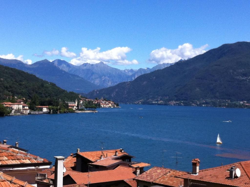 a view of a large body of water with mountains at Lake View Apartments in Acquaseria