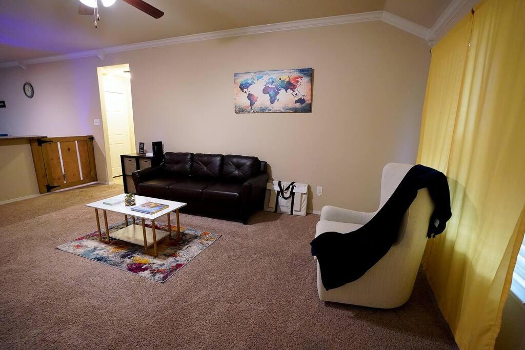 a living room with a couch and a table at North Little Rock Home Near Bases in North Little Rock