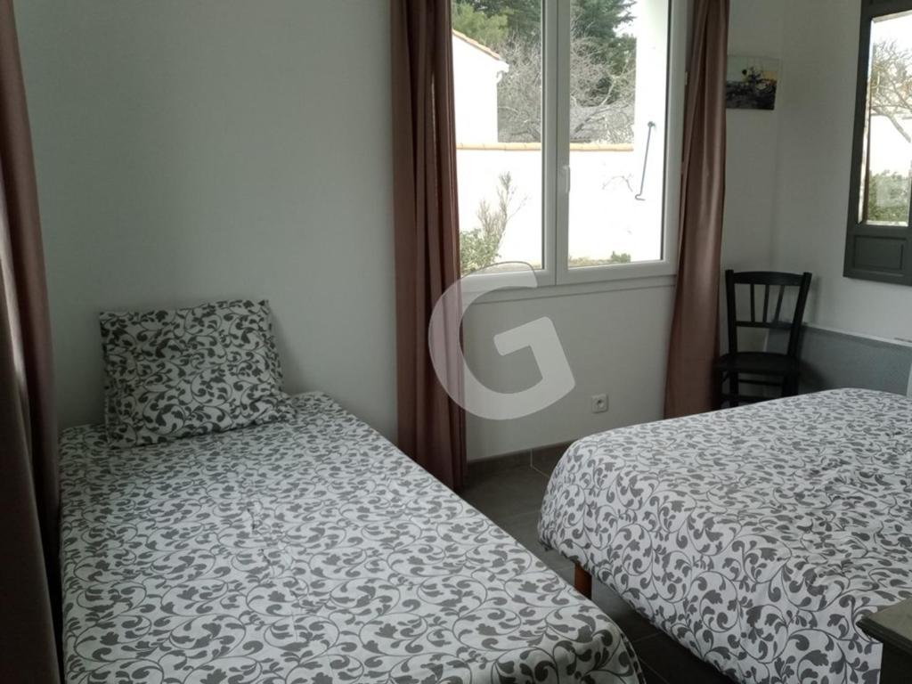 Posteľ alebo postele v izbe v ubytovaní Maison proche mer pour 8 personnes avec terrasse, proche commerces et activités, La Tranche-sur-Mer - FR-1-357-297