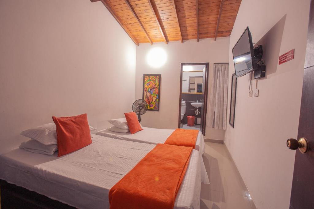 Postel nebo postele na pokoji v ubytování Hotel Palma De Sevilla