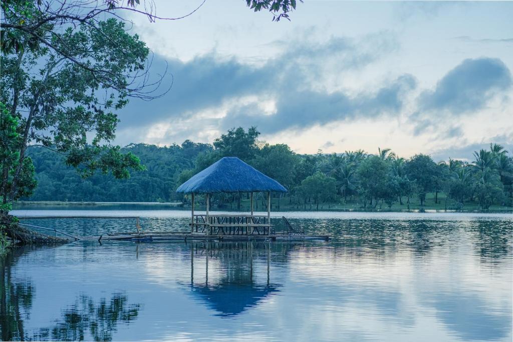 a gazebo in the middle of a lake at Almost Heaven Lake Resort by Cocotel in Cavinti