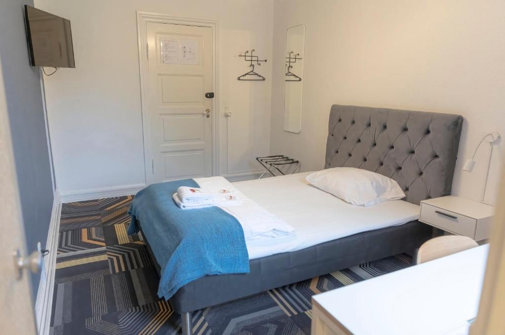 Postel nebo postele na pokoji v ubytování Hotel Harmonien