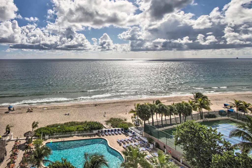 a view of the beach from the balcony of a resort at Luxe Beachfront Ft Lauderdale Resort Condo with Pool apts in Fort Lauderdale