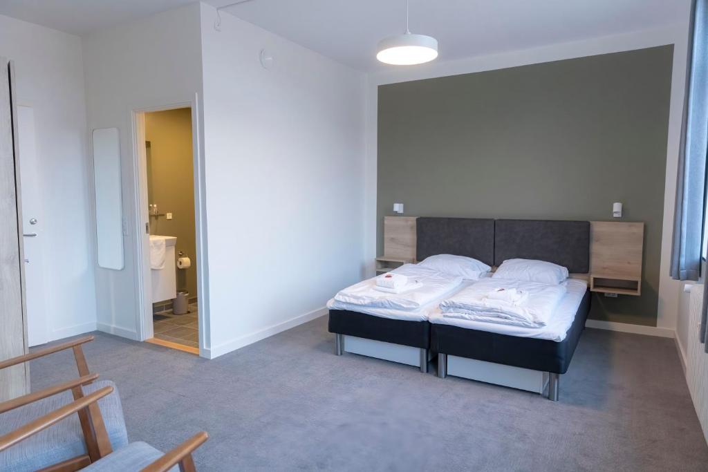 Postel nebo postele na pokoji v ubytování Hotel Harmonien