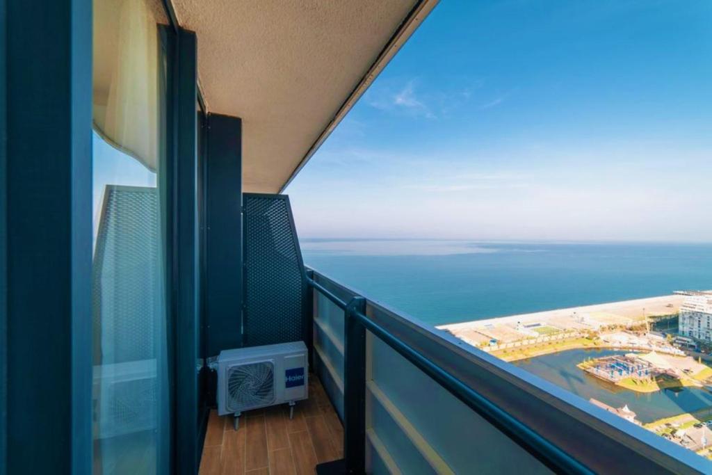 a balcony with a view of the ocean at Orbi City Sea View - Special Category in Batumi