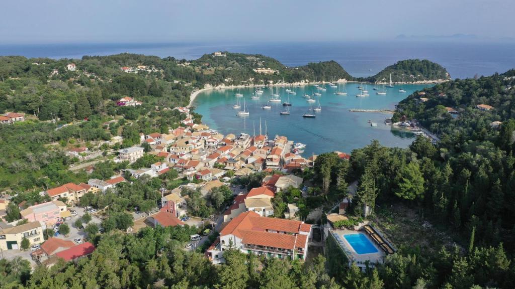 an aerial view of a town with boats in the water at Bastas Hotel & Studios in Lákka