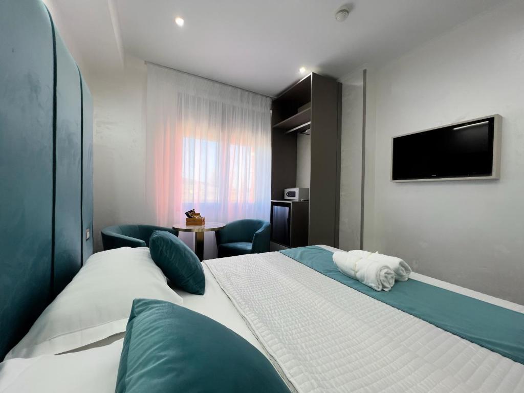 Giường trong phòng chung tại Hotel Paradiso