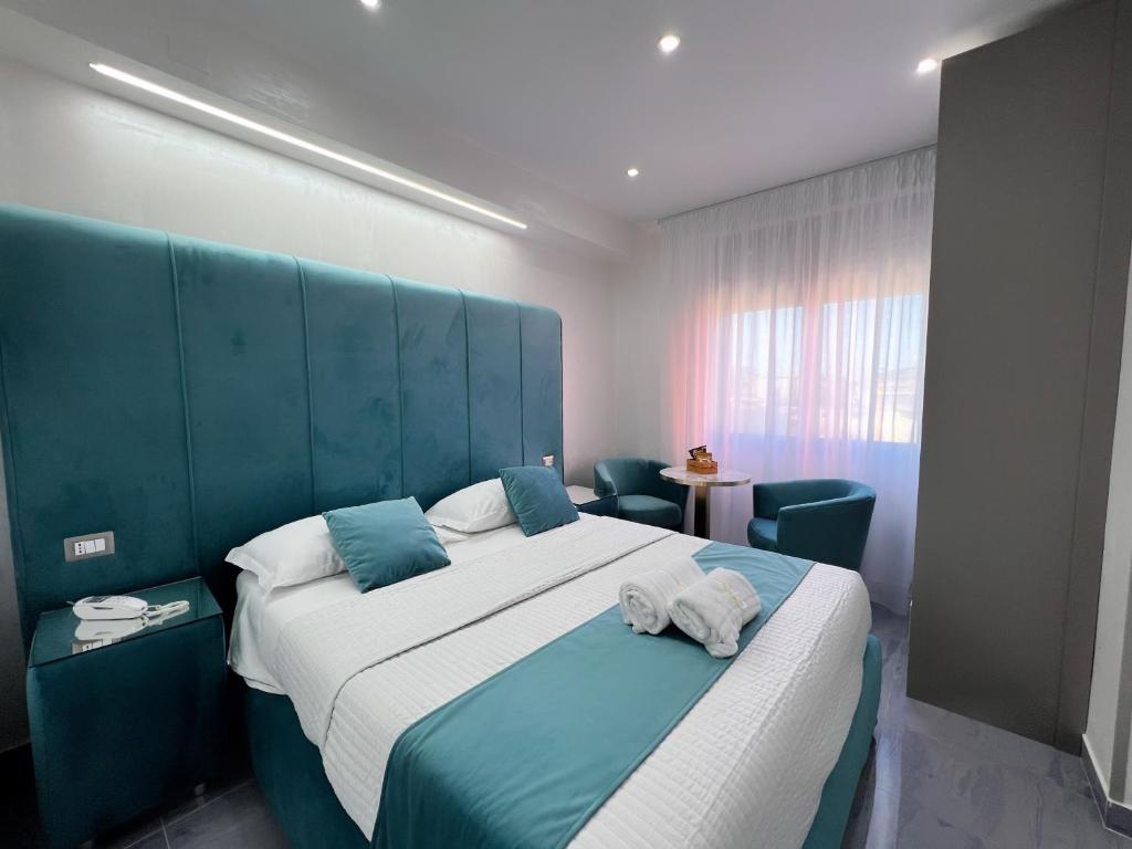 Postel nebo postele na pokoji v ubytování Hotel Paradiso