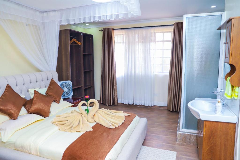 Postel nebo postele na pokoji v ubytování Villa Winga Deluxe Hotel