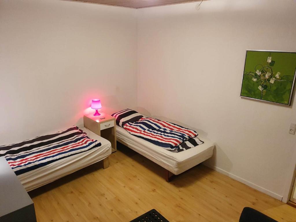 Postel nebo postele na pokoji v ubytování Rundvejen Guest House
