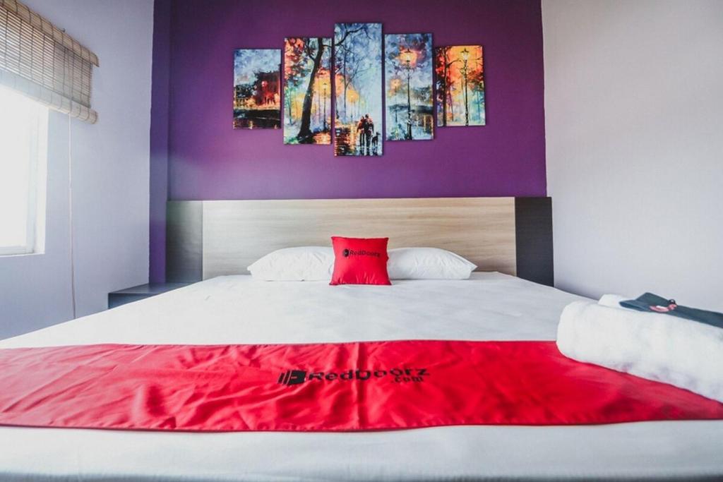 Postel nebo postele na pokoji v ubytování RedDoorz @ myRoom UMY