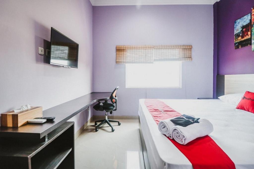 TV a/nebo společenská místnost v ubytování RedDoorz @ myRoom UMY