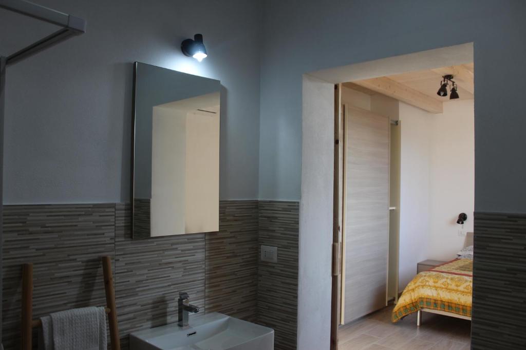 Postel nebo postele na pokoji v ubytování Agriturismo Mimosa