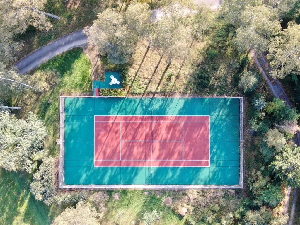 an overhead view of a tennis court in a field at Villa Mustikka in Ekenäs