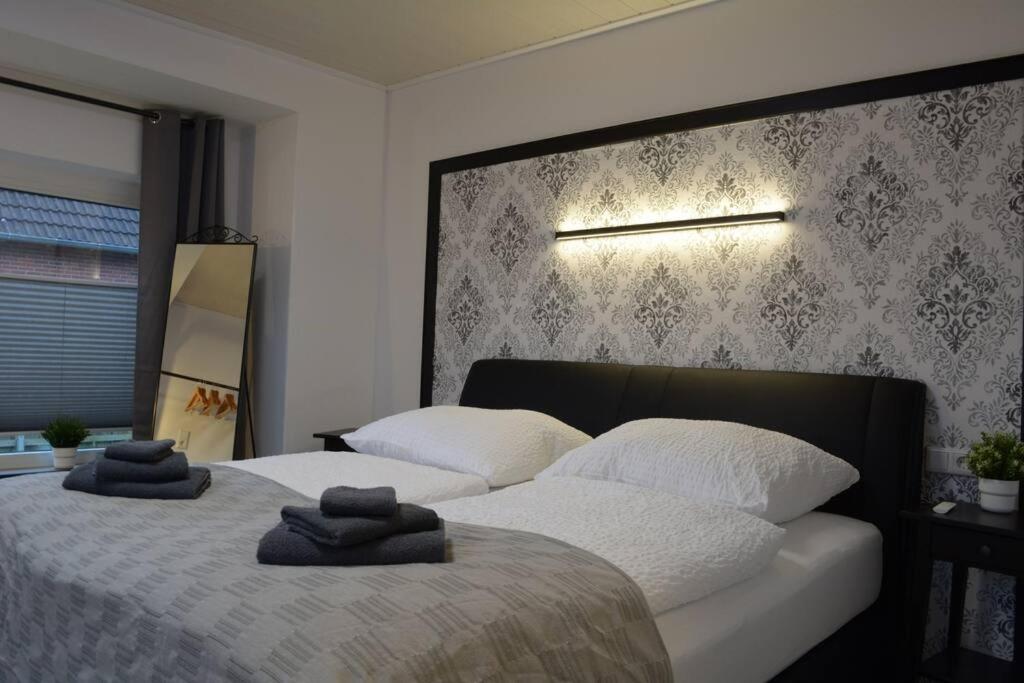 Säng eller sängar i ett rum på Ferienhaus Kiebitznüst in Emden