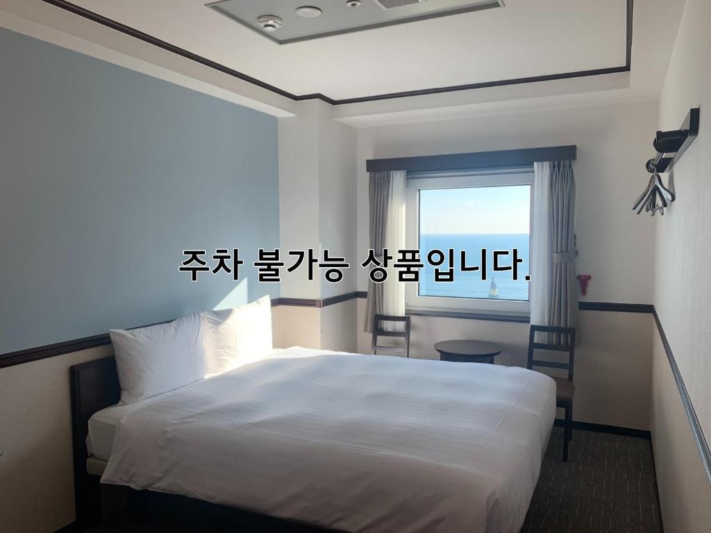 Postel nebo postele na pokoji v ubytování Toyoko Inn Busan Haeundae 2