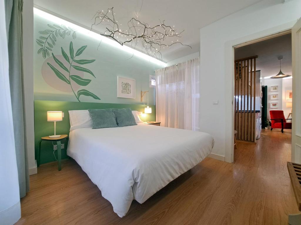 Llit o llits en una habitació de JARDÍN CENTRO