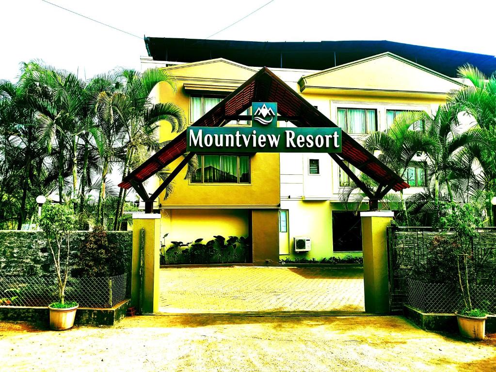 a building with a sign that reads mountain resort at Mountview Resort in Lonavala