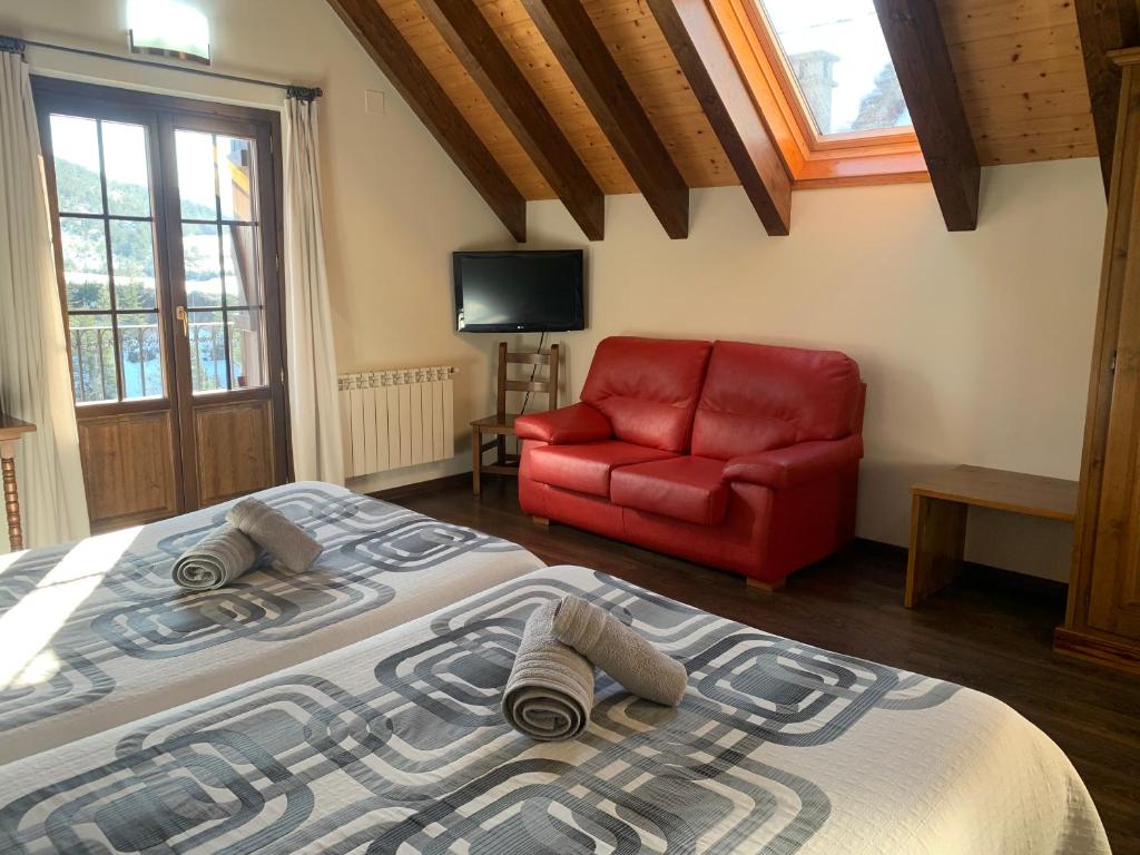 Postel nebo postele na pokoji v ubytování Casa Taconera