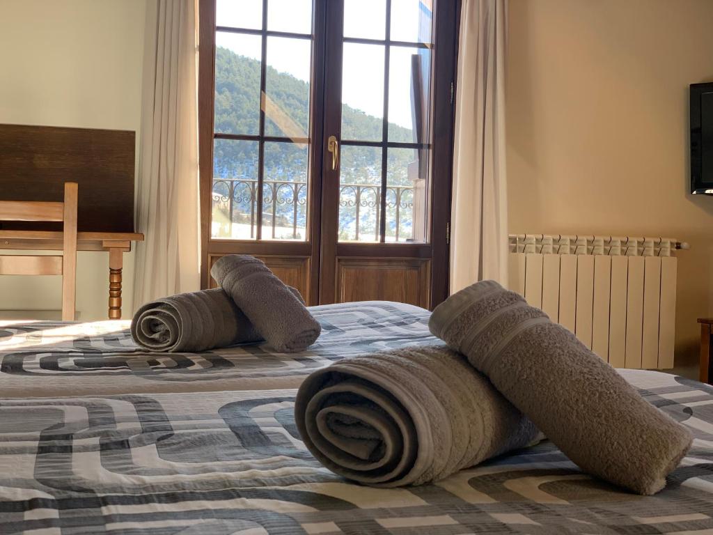 Postel nebo postele na pokoji v ubytování Casa Taconera