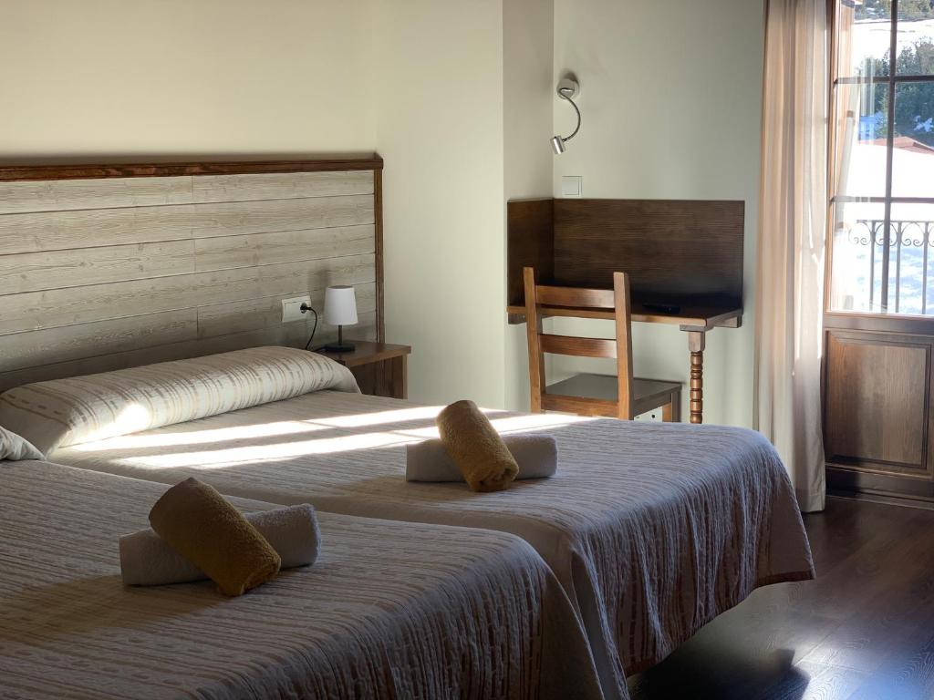 Postel nebo postele na pokoji v ubytování Casa Taconera